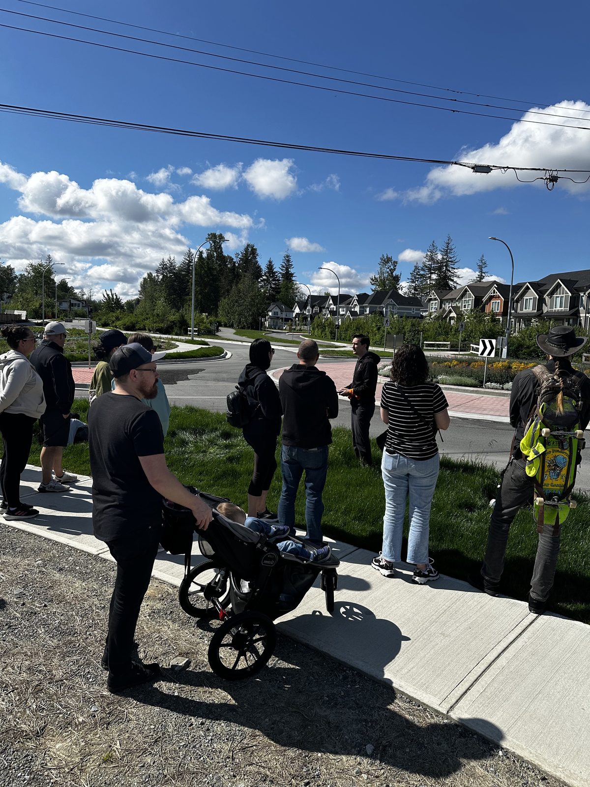 A parent with a stroller on a neighbourhood walk